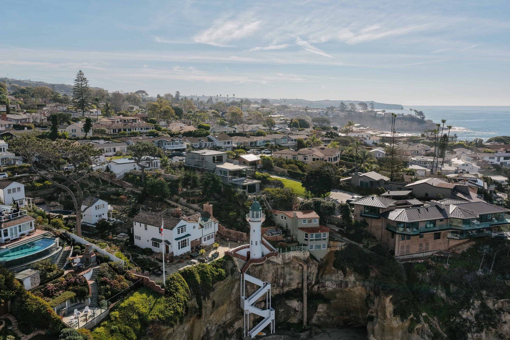 An aerial view of the Three Arch Bay bluffs in Laguna Beach with homes overlooking the ocean.